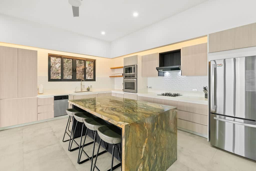 Chef's kitchen with exotic granite island