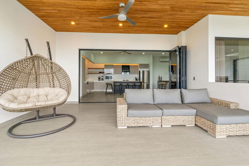 Covered Poolside Lounge with Hanging Egg Chair